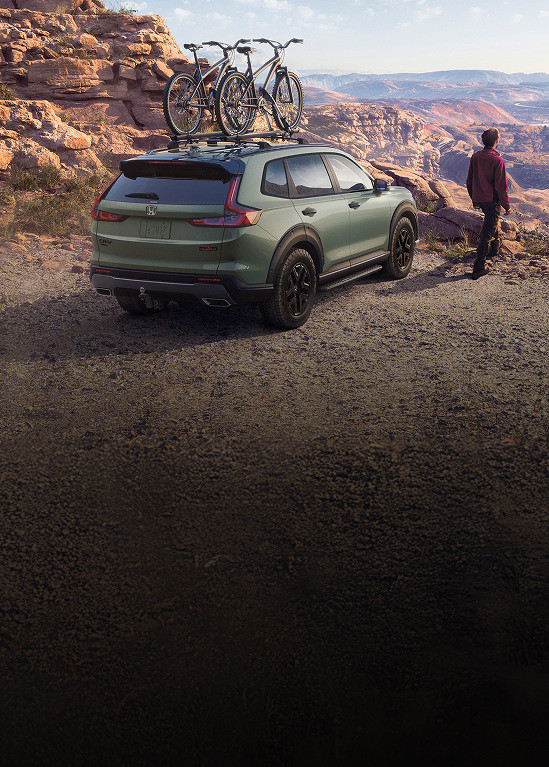 2026 Honda CR-V TrailSport in Ash Green Metallic with Original accesories parked in a mountain.