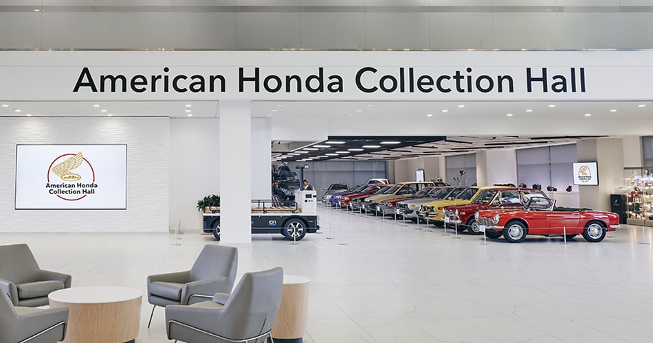 Classic Honda automobiles in The American Honda Collection lobby.
