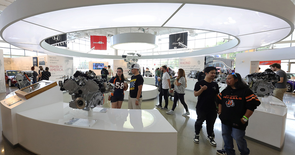 Visitors exploring exhibits at Honda's Heritage Center.